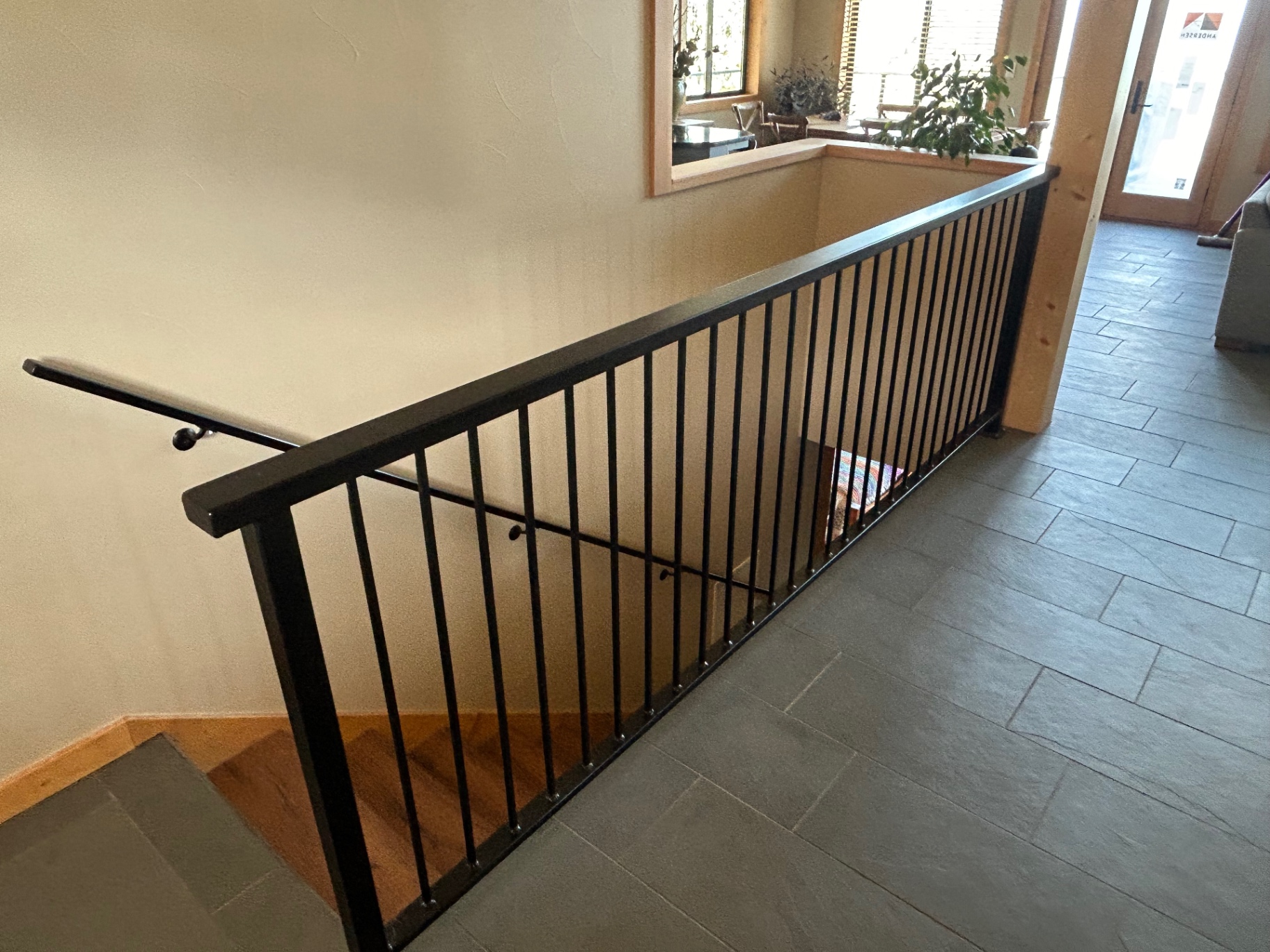 Custom welded interior steel hand rail with picket infill